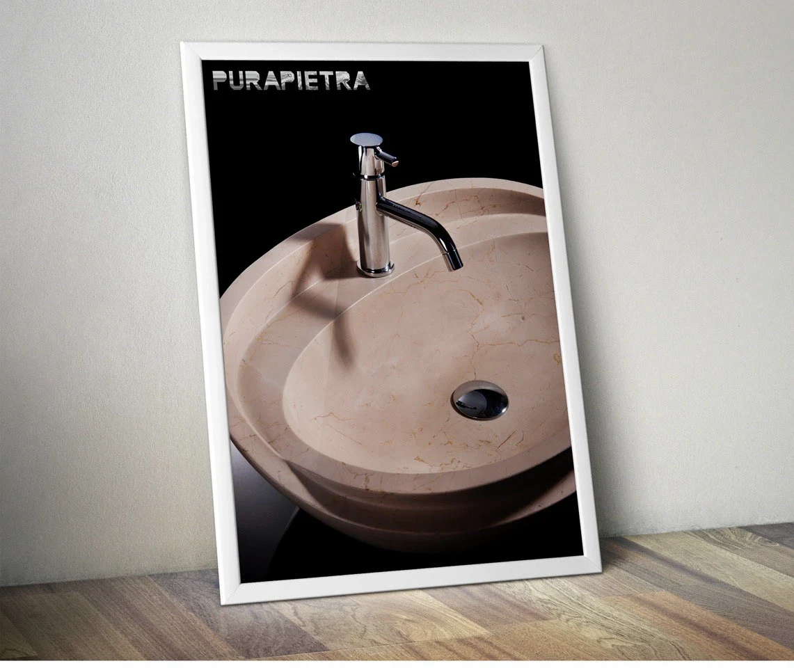 Pura Pietra: fotografia di prodotto di un lavabo in pietra con rubinetto cromato